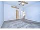 Bedroom with ceiling fan and access to bathroom at 30817 Prout Ct, Wesley Chapel, FL 33543