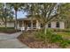 Community center building with landscaping and walkway at 30817 Prout Ct, Wesley Chapel, FL 33543