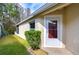 House exterior with a side view of the home and landscaping at 30817 Prout Ct, Wesley Chapel, FL 33543