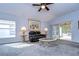 Living room featuring a comfy leather recliner and a large artwork at 30817 Prout Ct, Wesley Chapel, FL 33543