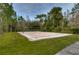 Sand volleyball court with net and surrounding greenery at 30817 Prout Ct, Wesley Chapel, FL 33543