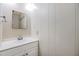 Clean and simple bathroom with white vanity and mirror at 36810 Kay Ave, Zephyrhills, FL 33542