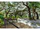 Relaxing park with benches under mature oak trees at 36810 Kay Ave, Zephyrhills, FL 33542