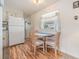 Kitchen features white appliances and a small dining table at 36810 Kay Ave, Zephyrhills, FL 33542