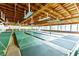 Indoor shuffleboard courts with wooden beams and lighting at 36810 Kay Ave, Zephyrhills, FL 33542