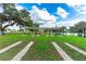 Outdoor shuffleboard courts with covered seating and lake view at 36810 Kay Ave, Zephyrhills, FL 33542