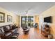 Living room with leather furniture and golf course view at 3780 Pinebrook Cir # 106, Bradenton, FL 34209