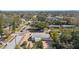 Aerial view of a single-story house with a gravel driveway, showcasing the surrounding neighborhood at 3992 60Th N St, St Petersburg, FL 33709