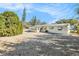 Gravel backyard with a view of the back of the house at 3992 60Th N St, St Petersburg, FL 33709