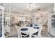 Bright dining room with white table and chairs, adjacent to the kitchen at 3992 60Th N St, St Petersburg, FL 33709