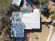 Overhead view of a house featuring a pool and spacious yard at 400 Country Club Dr, Oldsmar, FL 34677