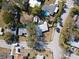 High-angle view of a house with a pool and surrounding homes at 400 Country Club Dr, Oldsmar, FL 34677