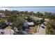 Aerial view of a single Gathering home and surrounding neighborhood at 400 Country Club Dr, Oldsmar, FL 34677