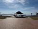 Brick gazebo overlooking a tranquil waterfront scene at 400 Country Club Dr, Oldsmar, FL 34677