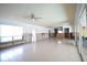 Large living room with tile floors, needs updating at 400 Country Club Dr, Oldsmar, FL 34677