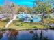 Aerial view of home on waterfront property at 404 Manor Blvd, Palm Harbor, FL 34683