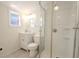 Clean bathroom with shower, toilet and vanity, bright and airy at 404 Manor Blvd, Palm Harbor, FL 34683