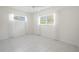 Bright bedroom with tile flooring and white walls at 404 Manor Blvd, Palm Harbor, FL 34683