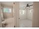 Open view of bedroom and attached bathroom with tub and shower at 404 Manor Blvd, Palm Harbor, FL 34683