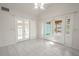 Bright Gathering room with double doors and tile floors at 404 Manor Blvd, Palm Harbor, FL 34683