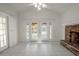 Bright Gathering room with fireplace and sliding doors to patio at 404 Manor Blvd, Palm Harbor, FL 34683