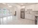 Modern kitchen with white cabinets and stainless steel appliances at 404 Manor Blvd, Palm Harbor, FL 34683