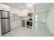 Modern kitchen with white cabinets and stainless steel appliances at 404 Manor Blvd, Palm Harbor, FL 34683