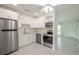 Modern kitchen with white cabinets and stainless steel appliances at 404 Manor Blvd, Palm Harbor, FL 34683