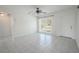 Simple living room with tile floors and a window providing natural light at 404 Manor Blvd, Palm Harbor, FL 34683