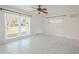 Spacious living area featuring tile floors and large windows at 404 Manor Blvd, Palm Harbor, FL 34683