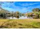 Tranquil waterfront view with lush landscaping at 404 Manor Blvd, Palm Harbor, FL 34683