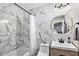 Updated bathroom with marble tile and modern vanity at 4128 Dolphin Dr, Tampa, FL 33617