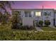 Front view of a two-story condo building with landscaping at 4128 Dolphin Dr, Tampa, FL 33617