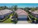 Attractive single-story home with tile roof, two-car garage, and landscaped yard at 4415 Muirfield, Bradenton, FL 34210