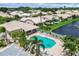 Aerial view of the community pool, showcasing its prime location and proximity to the well-manicured neighborhood at 4415 Muirfield, Bradenton, FL 34210