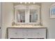 Double vanity bathroom with granite countertop and large mirrors at 4415 Muirfield, Bradenton, FL 34210