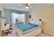 Bright bedroom with full-size bed and built-in shelving at 4415 Muirfield, Bradenton, FL 34210