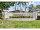 Highland Lakes community entrance sign surrounded by lush greenery, creating an inviting and welcoming ambiance at 4415 Muirfield, Bradenton, FL 34210