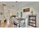 Bright dining room with hardwood floors, and farmhouse style table at 4415 Muirfield, Bradenton, FL 34210