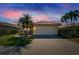 Charming one-story home with tile roof, two-car garage, and well-manicured lawn at 4415 Muirfield, Bradenton, FL 34210