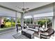 Relaxing sunroom with wicker furniture and lots of natural light at 4415 Muirfield, Bradenton, FL 34210