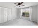 Spacious bedroom featuring double door closet and a window at 4529 Whitton Way # 211, New Port Richey, FL 34653