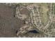 Aerial view showing home location nestled in a quiet neighborhood near a lake and golf course at 4814 Northdale Blvd, Tampa, FL 33624