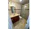 Updated bathroom with glass shower and vanity at 4814 Northdale Blvd, Tampa, FL 33624