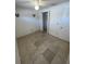 Well lit bedroom with tile floors and double door closet at 4814 Northdale Blvd, Tampa, FL 33624