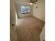 Spacious bedroom with tile floors and large window at 4814 Northdale Blvd, Tampa, FL 33624