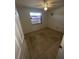 Simple bedroom with tile floors and a window at 4814 Northdale Blvd, Tampa, FL 33624