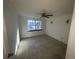 Roomy bedroom with tile floor and a large window at 4814 Northdale Blvd, Tampa, FL 33624