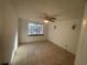 Spacious bedroom with tile floors and ceiling fan at 4814 Northdale Blvd, Tampa, FL 33624