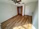 Bright bedroom with wood-look floors and spacious closet at 4814 Northdale Blvd, Tampa, FL 33624